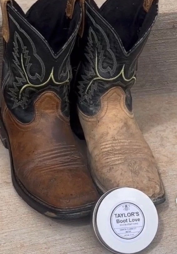 Pair of brown cowboy boots with intricate black stitching next to a container labeled 'Taylor's Boot Love' on a wooden surface. The boot treated with 'Taylor's Boot Love' looks newer and nicer.